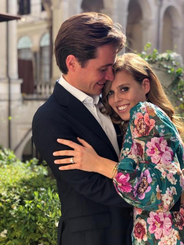 In an undated recent handout picture released by Buckingham Palace and taken by Princess Eugenie of York, Princess Beatrice of York poses with her fiancee Edoardo Mapelli Mozzi in Italy. The couple "became engaged while away for the weekend in Italy earlier this month," the palace said in a statement, adding that the wedding will take place in 2020. Princess Eugenie/Buckingham Palace/AFP