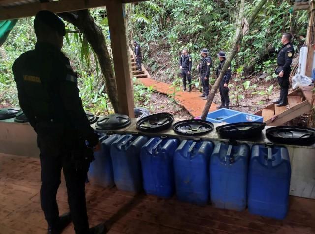 Agents of the Guatemalan National Civil Police (PNC) are seen during an operation to dismantle a coca processing lab in Izabal, Guatemala September 19, 2019. National Civil Police/Handout via REUTERS