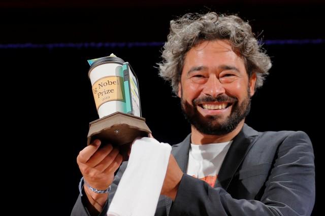 Silvano Gallus of Italy accepts the Ig Nobel Prize in Medicine for the study "Does Pizza Protect Against Cancer?" at the 29th First Annual Ig Nobel Prize Ceremony at Harvard University in Cambridge, Massachusetts, US, September 12, 2019. REUTERS/Brian Snyder