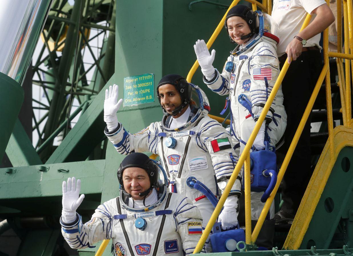 The International Space Station (ISS) crew members Jessica Meir of the US, Oleg Skripochka of Russia and Hazzaa Ali Almansoori of United Arab Emirates board the Soyuz MS-15 spacecraft for the launch at the Baikonur Cosmodrome, Kazakhstan September 25, 2019. Maxim Shipenkov/Pool via REUTERS/File photo