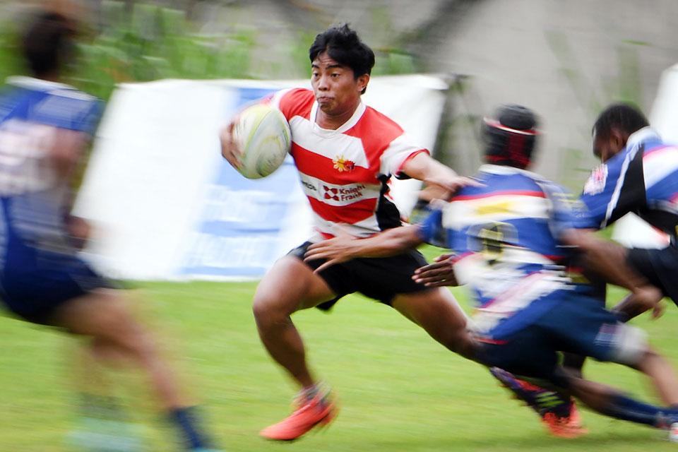 Lito Ramirez (center) during a rugby match in Silangan, Laguna in this photo taken on June 15, 2019. Long before Ramirez was one of the Philippines' first homegrown rugby stars he was a six-year-old orphan addicted to sniffing glue, who survived on trash and begging. In 2015, Ramirez was one of the first born and bred Pinoys (Filipinos) to land a spot on the Philippines national squad, the Volcanoes. AFP/Noel Celis