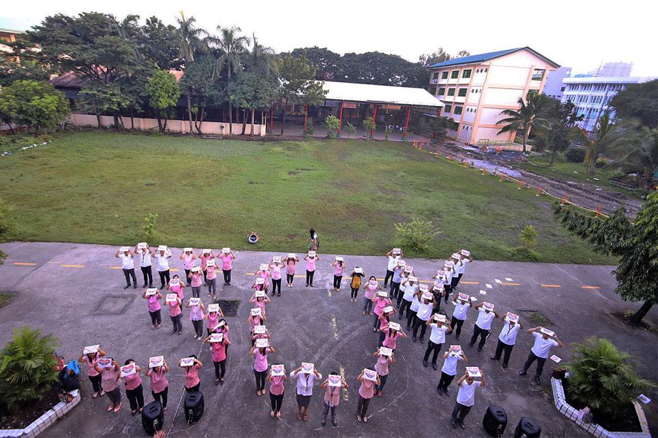 Teachers from Carlos Albert High School in Quezon City use a human formation at the school compound on Monday, Sept. 23 2019, to continue their demand for a substantial pay hike for public school teachers. GMA News