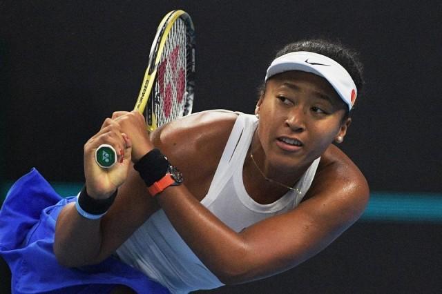 Naomi Osaka of Japan hits a return during the women's singles final against Ashleigh Barty of Australia at the China Open tennis tournament in Beijing on October 6, 2019. Noel Celis/AFP