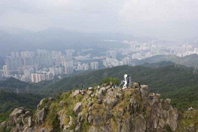 This aerial photo shows a four-meter statue known as "Lady Liberty" after it was hauled by pro-democracy protesters to the top of Lion Rock, one of the Hong Kong's most famous mountain tops, on October 13, 2019, announcing that the peak would be its "final resting" place. Anthony Wallace/AFP