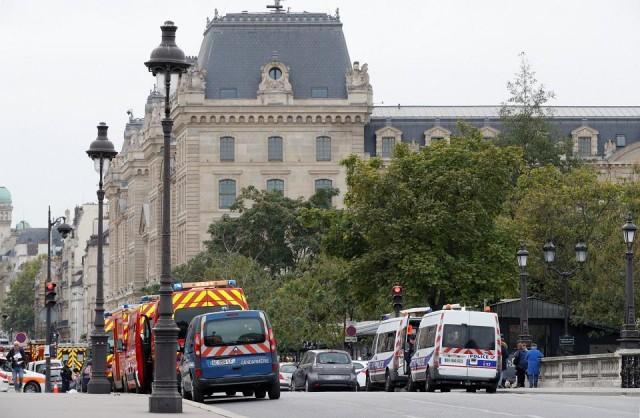 Vehicles of the French police are seen near the Paris Police headquarters in Paris, France, October 3, 2019. REUTERS/Philippe Wojazer