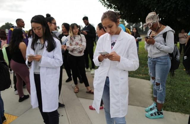 Compton Community College students participate in the Great ShakeOut earthquake drill as California releases its new MyShake early warning app, in Los Angeles, California, October 17, 2019. REUTERS/Lucy Nicholson