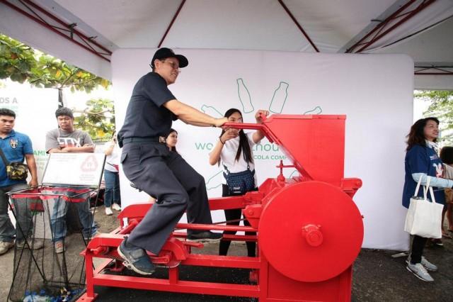 The Coca-Cola TuneCycle shreds plastic bottles into small pieces which are then recycled into new items.