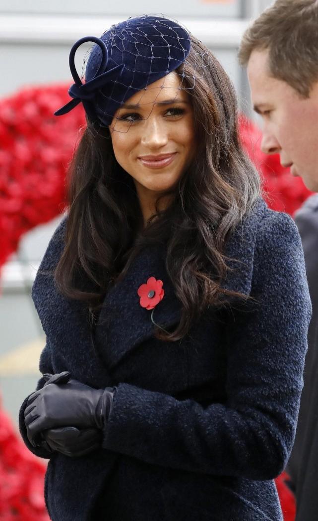 Meghan, Duchess of Sussex leaves after paying her respects during a visit to the Field of Remembrance at Westminster Abbey in central London on November 7, 2019. Tolga Akmen/AFP