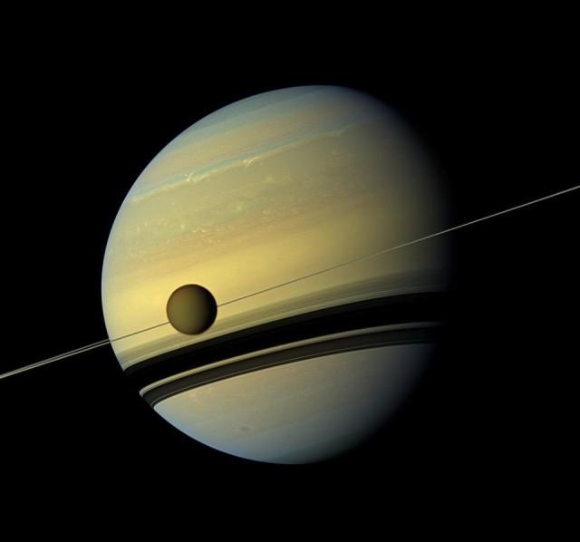 This file photo taken on August 31, 2012 shows a natural color view of Titan and Saturn from NASA's Cassini spacecraft. Handout/NASA/AFP