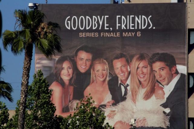 The cast of the popular comedy television series "Friends," which ended its ten year run on May 6, 2004, are pictured on a giant billboard promoting the series finale, at the NBC television network office in Burbank, California, May 3, 2004. Cast members (L-R) are Courteney Cox Arquette as Monica, Matt Le Blanc as Joey, Lisa Kudrow as Pheobe, Matthew Perry as Chandler, Jennifer Aniston as Rachel and David Schwimmer as Ross. PHOTOGRAPH TAKEN MAY 3 REUTERS/Fred Prouser/File photo