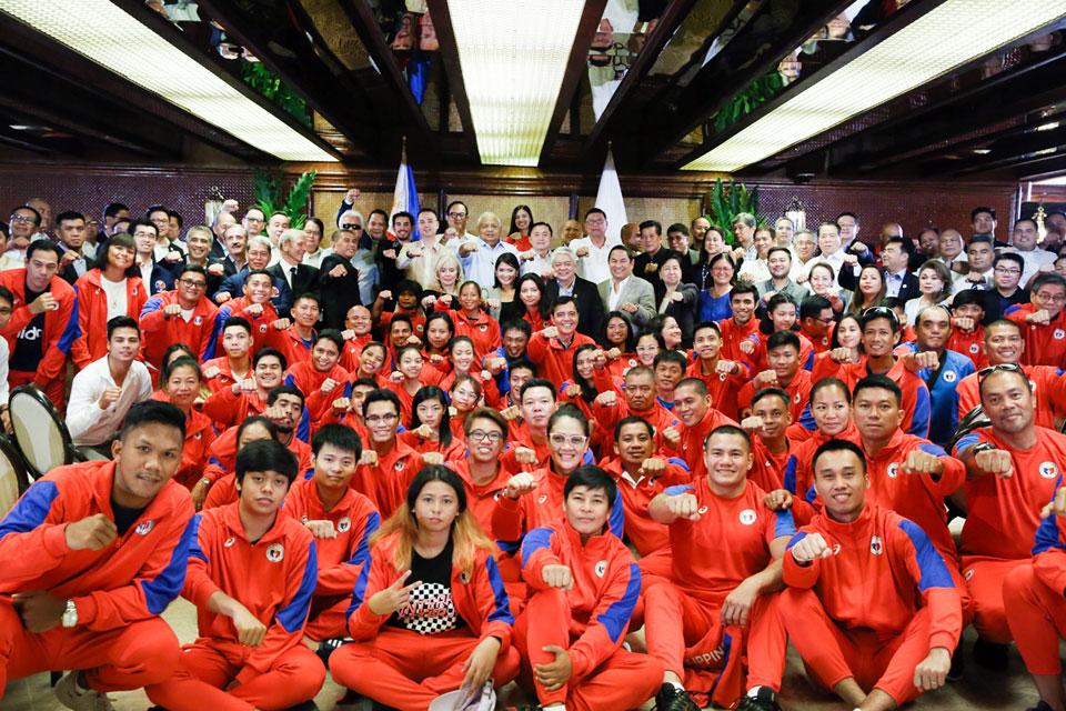 In this file photo taken July 24, 2019, Speaker Alan Peter Cayetano, Executive Secretary Salvador Medialdea and Philippine Sports Commission officials pose with Filipino athletes during the 'Call for Unity for the 30th Southeast Asian Games' in MalacaÃ±ang. Albert Alcain/PPD/File 