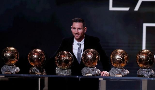 Barcelona's Lionel Messi with his six Ballon d'Or trophies REUTERS/Christian Hartmann