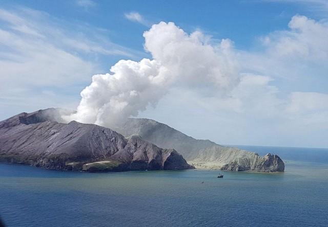 This photo taken December 9, 2019 and released December 10, 2019 by the Auckland Rescue Helicopter Trust shows the view from a rescue helicopter as it heads toward the smoldering White Island volcano off the coast of New Zealand's North Island. Survivors on December 10 recounted dramatic escapes and tales of heroism when the smoldering White Island volcano roared into life, amid 'unfathomable grief' over the eruption that is believed to have claimed 13 lives. AFP/ARHT