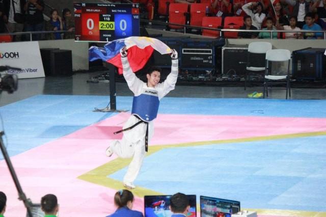 Dave Cea takes a victory lap after defeating Thailand in the taekwondo men's under-74kg finals at the Southeast Asian Games on Sunday, December 8, 2019 at the Rizal Memorial Sports Complex. Zeke Alonzo