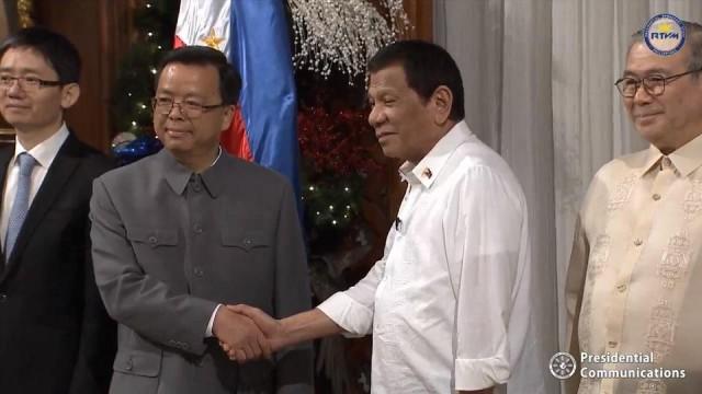 President Rodrigo Duterte shakes hands with new Chinese Ambassador to the Philippines Huang Xilian in Malanang on Decemner 4, 2019. Screenshot: RTVM