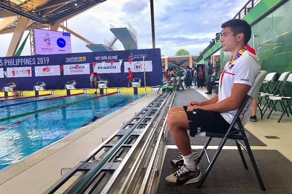 Fil-Am tanker James Deiparine sits at the poolside of the New Clark City Aquatic Center in Tarlac during an interview with GMA News reporter Ian Cruz on Thursday, December 5, 2019. Deiparine said, "It feels really good after last 2017 SEA Games I got two silvers so it&acirc;s kinda redemption for me to get a gold in front of the home crowd. It just means a lot to me and really proud of my heritage even though I wasn't born and raised in the Philippines." Deiparine was born in the US. Ian Cruz