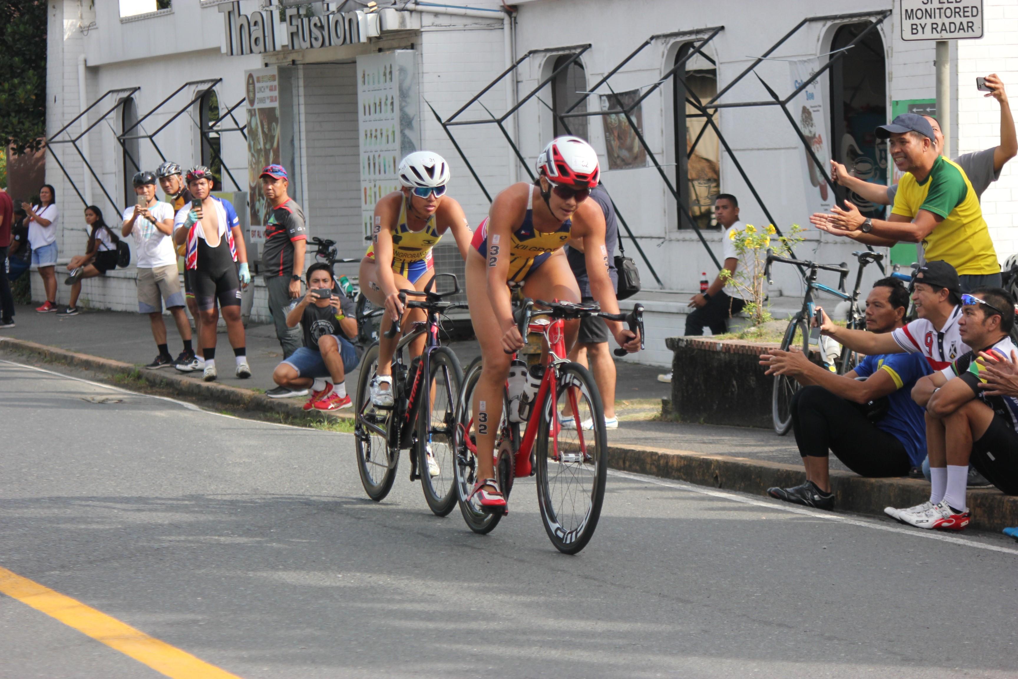 Kim Mangrobang (left) and Kim Kilgroe finished first and second, respectively, in the women's triathlon event.