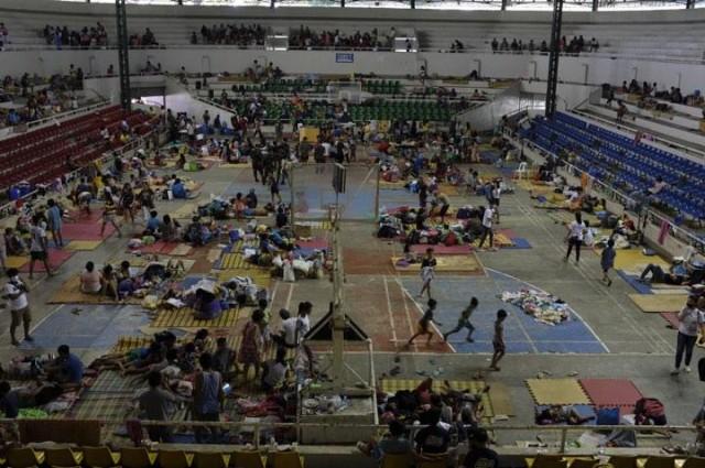 Affected families staying in evacuation center at Batangas City Sports Complex. Photo by LJ Pasion, Save the Children