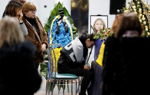 Mourners surround coffins containing the remains of the eleven Ukrainian victims of the Ukraine International Airlines flight 752 plane disaster during a memorial ceremony at the Boryspil International Airport, outside Kiev, Ukraine January 19, 2020. REUTERS/Gleb Garanich