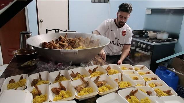 Basel packs the Chicken Kabsa for the Taal evacuees. Photo by The Hungry Syrian Wanderer