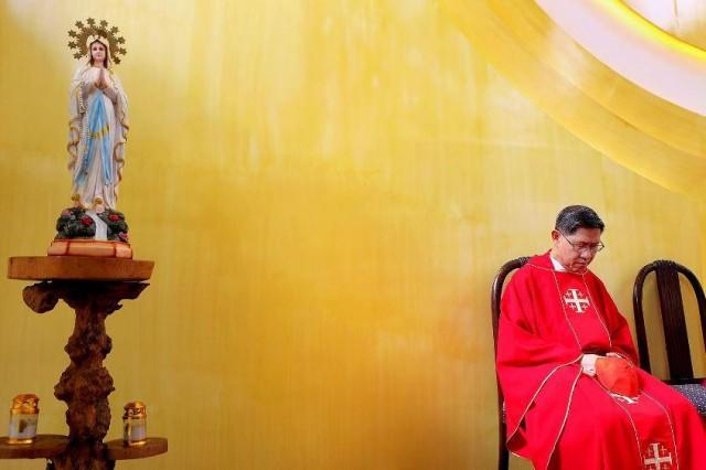 Manila Archbishop Luis Antonio Tagle is shown sitting a few meters from an image of the Blessed Virgin Mary. PHOTO FROM CBCP NEWS