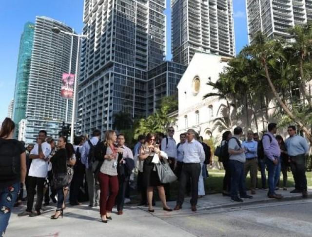 People wait outside after evacuating office buildings after an earthquake struck south of Cuba on January 28, 2020 in Miami, Florida. The magnitude 7.7 earthquake struck northwest of Jamaica, according to the U.S. Geological Survey. Joe Raedle/Getty Images/AFP JOE RAEDLE / GETTY IMAGES NORTH AMERICA / AFP
