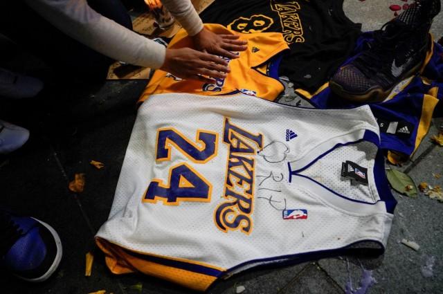 Flowers and memorabilia left as a tribute near the Staples Center to pay respects to Kobe Bryant after a helicopter crash killed the retired basketball star, in Los Angeles, California, U.S., January 26, 2020. REUTERS/Kyle Grillot