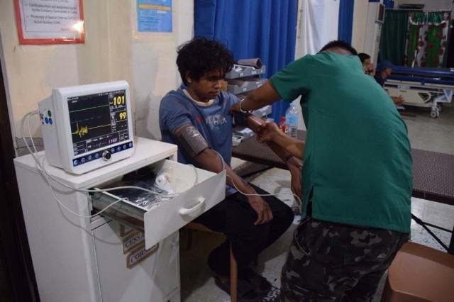 Indonesian Muhammad Farhan undergoing medical check up after he was rescued from the Abu Sayyaf Group on Wednesday. PHOTO FROM Armed Forces of the Philippines