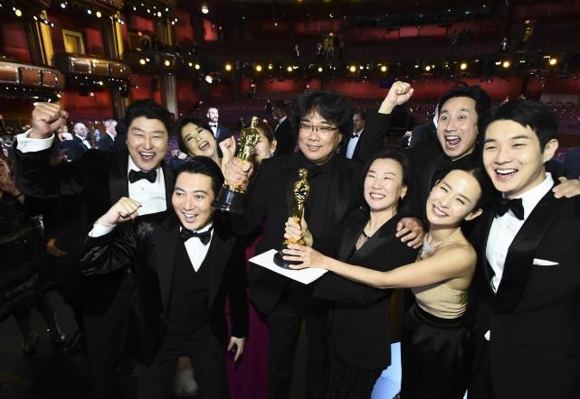 In this handout photo provided by A.M.P.A.S. Best Picture Award winners for "Parasite" pose onstage during the 92nd Annual Academy Awards at the Dolby Theatre on February 09, 2020 in Hollywood, California. AMPAS via AFP