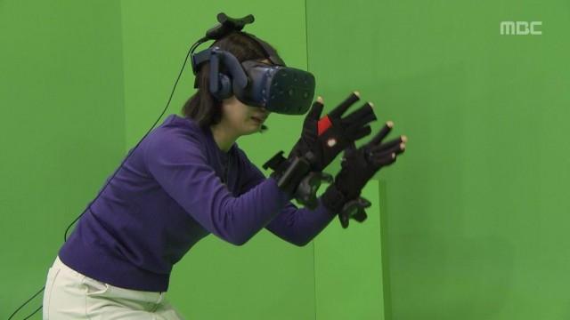 This undated handout photo provided on February 14, 2020 by South Korea's Munhwa Broadcasting Corporation (MBC) in Seoul shows a scene of a documentary "I met you" where a mother meets her dead daughter through virtual reality. Handout/Munhwa Broadcasting Corporation/AFP 