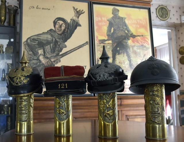 The French "Adrian" helmet from 1915 is displayed to the right of three other helmets from roughly the same period in this file photo taken August 29, 2018 in the house of Serge and Chantal Giudice in Balma, France. Pascal Pavani/AFP