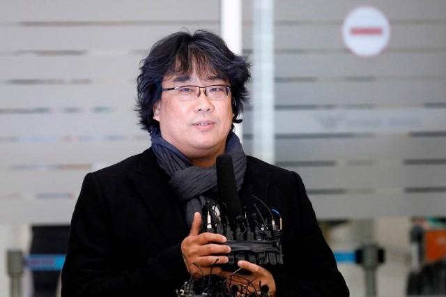 'Parasite' director Bong Joon-ho speaks to reporters and fans upon his arrival at Incheon International Airport in Incheon, South Korea, February 16, 2020. REUTERS/Kim Hong-Ji