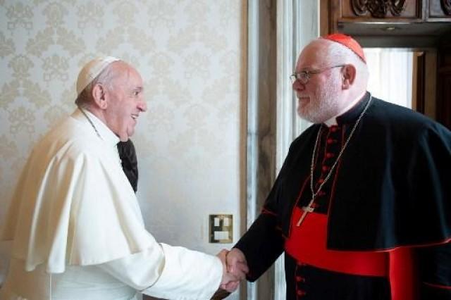 In this file photo taken and handout on February 3, 2020 by the Vatican Media, Pope Francis (L) greets chairman of the German Bishops' Conference, Archbishop of Munich and Freising, German Cardinal Reinhard Marx during a private audience at the Vatican. AFP PHOTO