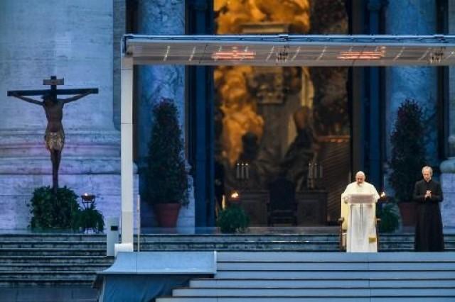 Pope Francis presides over a moment of prayer on the sagrato of St Peterâ€™s Basilica, the platform at the top of the steps immediately in front of the faÃ§ade of the Church, to be concluded with the Pope giving the Urbi et orbi Blessing, on March 27, 2020 at the Vatican. Vincenzo PINTO / AFP
