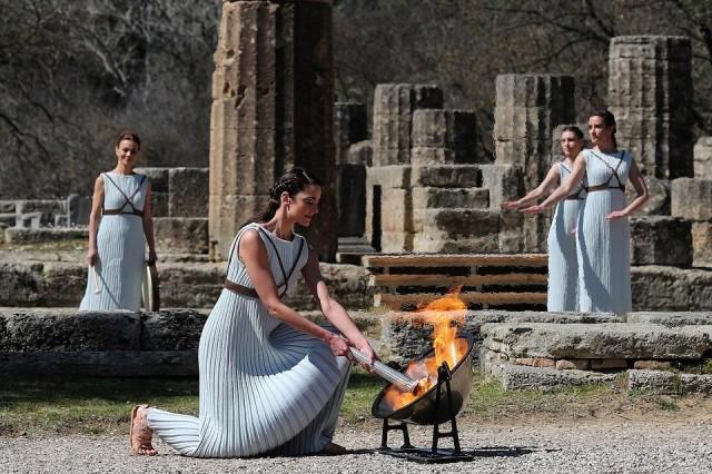 Greek actress Xanthi Georgiou, playing the role of High Priestess, lights the flame during the Olympic flame lighting ceremony for the Tokyo 2020 Summer Olympics in Olympia, Greece, on March 12, 2020. REUTERS/Alkis Konstantinidis
