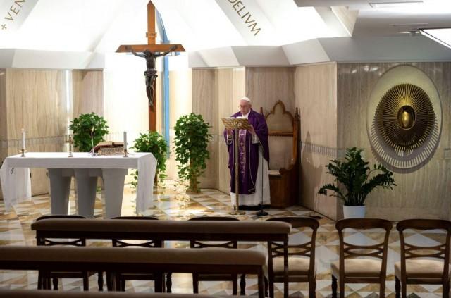 Pope Francis leads Mass via a video livestream in a chapel full of empty seats as part of measures to combat the spread of coronavirus, at the St. Martha House in the Vatican, March 10, 2020. Vatican Media/Â­Handout via REUTERS