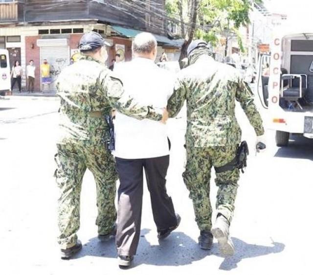 Man being apprehended for organizing religious event in violation of COVID-19 social distancing measures in Cagayan de Oro City. --CDO Regulatory Compliance Board 