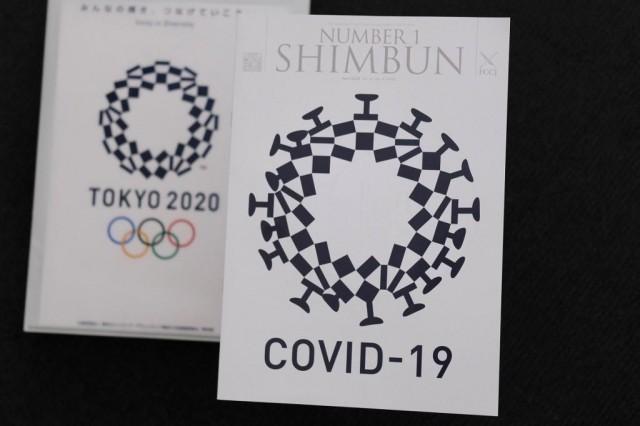 This photo taken May 21, 2020 in Tokyo shows the logo of the Tokyo 2020 Olympic Games (left) and the controversial satirical mock-up. AFP