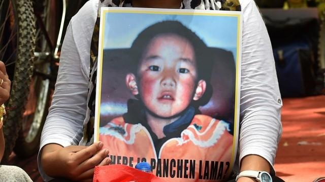 A Tibetan living in exile takes part in a rally in New Delhi on May 23, 2016 in support of the Panchen Lama, Tibetan Buddhism's second most important spiritual leader. Gedhun Choekyi Nyima, the 11th Panchen Lama, disappeared into Chinese custody in 1995 at the age of six after being chosen by The Dalai Lama and has not been seen since. Sajjad Hussain/AFP