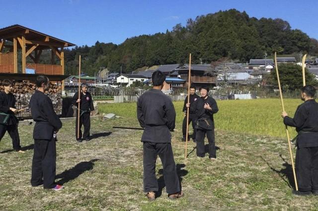 This undated handout photo received on June 26, 2020 courtesy of Genichi Mitsuhashi (2nd R) shows his ninja training in Iga, Mie prefecture. Genichi Mitsuhashi has become the first student ever to graduate from a Japanese university with a master's degree in ninja studies. Handout/ Courtesy of Genichi Mitsuhashi/AFP