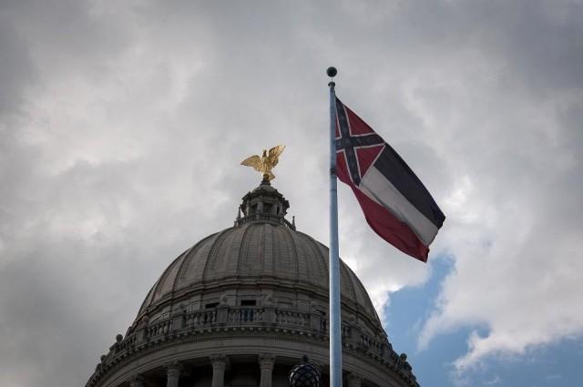 The Mississippi state flag flies in front of the Mississippi State Capitol building in Jackson, Mississippi on June 28, 2020. Lawmakers in Mississippi voted on June 28 to remove the Confederate battle standard from the state flag, after nationwide protests drew renewed attention to symbols of the United States' racist past. Rory Doyle/AFP