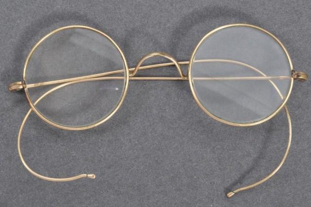 A handout picture released by East Bristol Auctions on August 19, 2020 shows a pair of glasses that once belonged to Indian independence icon Mohandas Karamchand Gandhi photographed at the action house in Bristol head of their sale. A pair of personal spectacles once owned by Mahatma Gandhi is to go on sale on August 21 at East Bristol Auctions with a pre-sale estimate of 10,000 to 15,000 GBP (13,000 to 20,000 USD). EAST BRISTOL AUCTIONS / AFP