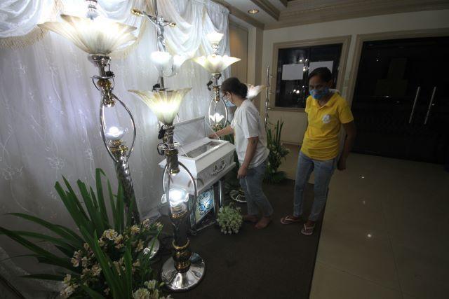 Marites Asis (in yellow)grandmother of Baby River Emmanuel Nasino, and her sister Veronica Vidal pay their last respects to the remains of Baby River, the 3 month old daughter of detained activist and urban poor advocate Reina Mae Nasino, who is a detainee at the Manila City Jail. DANNY PATA