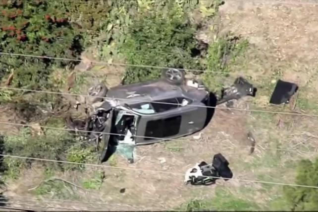 The vehicle of golfer Tiger Woods, who was rushed to hospital after suffering multiple injuries, lies on its side after being involved in a single-vehicle accident in Los Angeles, California, U.S. in a still image from video taken February 23, 2021. KNBC via REUTERS