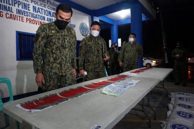 PNP Chief Police General Guillermo Eleazar inspects the seized materials for bomb-making (PNP handout photo)