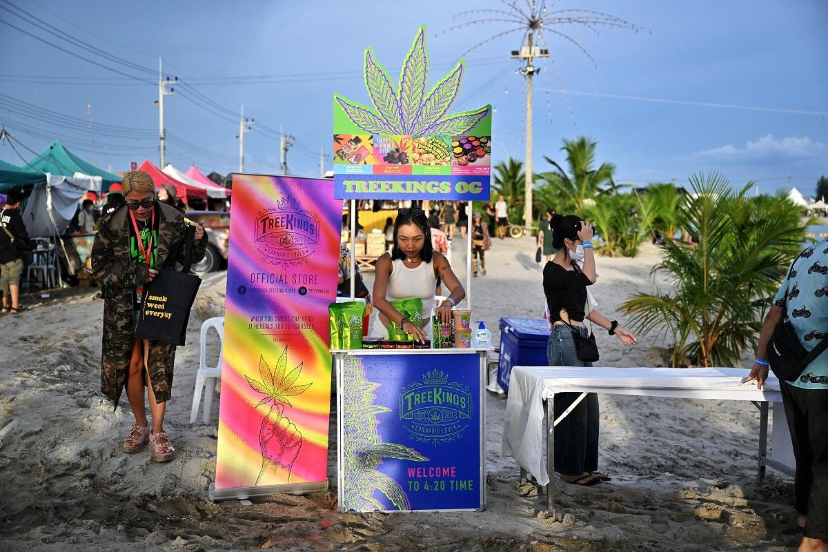 A vendor sells cannabis goods to celebrate the legalization of cannabis at the â€œThailand: 420 Legalaew!â€ weekend festival hosted by Highland in Nakhon Pathom province on June 11, 2022. Lillian Suwanrumpha/ AFP