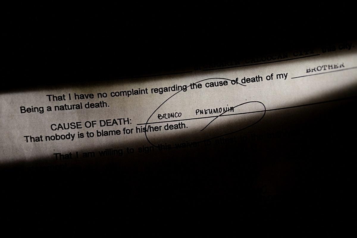 A copy of the waiver provided by the funeral home to the family of Lenin Baylon, is seen in Quezon City, April 8, 2022. REUTERS/ Eloisa Lopez