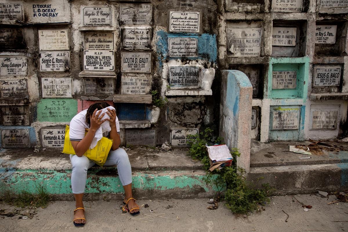 A relative of drug war victims cries after witnessing the exhumation of her loved ones at Navotas Cemetery, Navotas City,July 8, 2021. REUTERS/ Eloisa Lopez