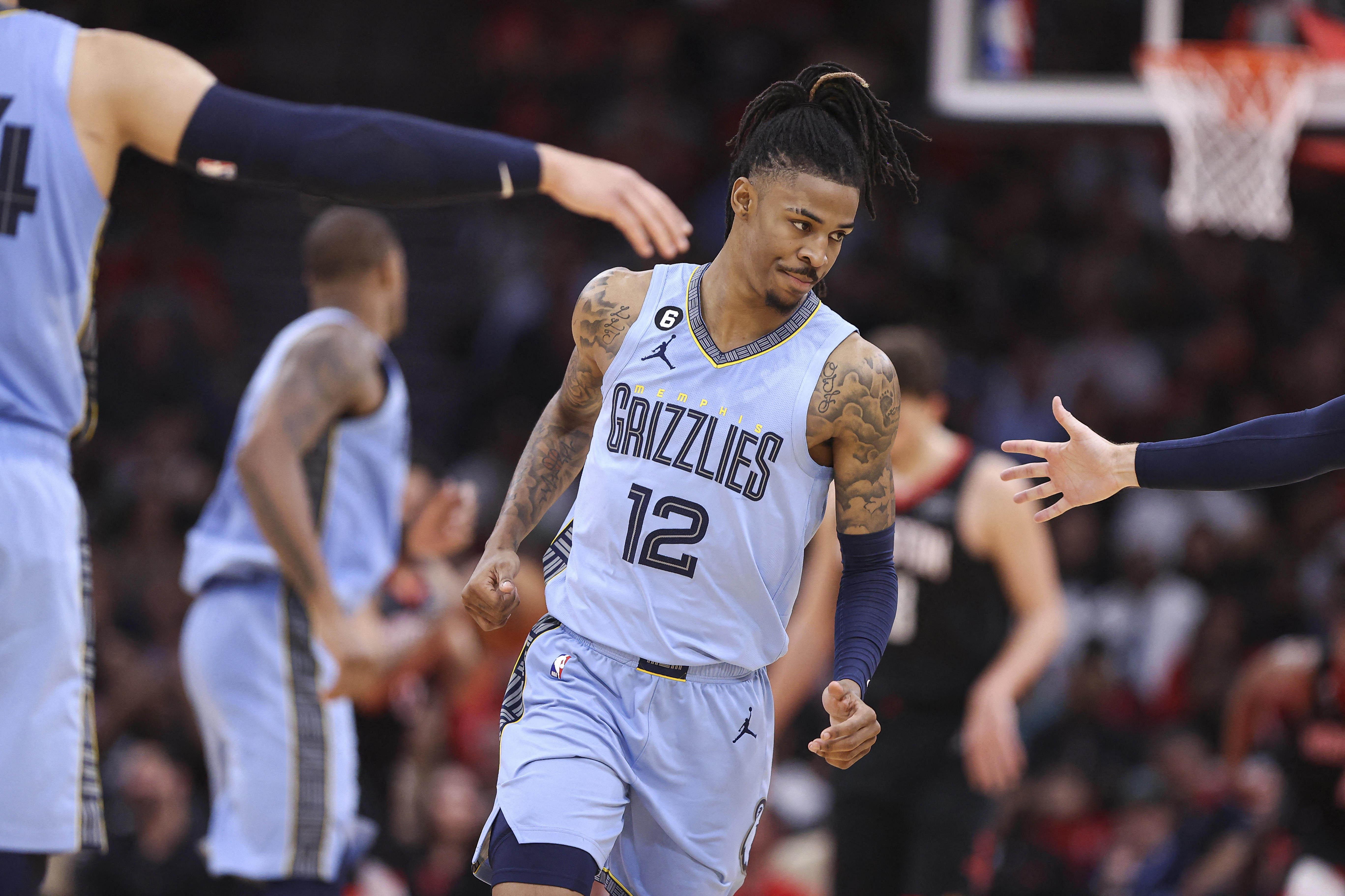 Ja Morant Celebrates Grizzlies Teammate's $207,000,000 Contract with NBA  World An Hour After Welcoming His New Guns n' Roses Partner 