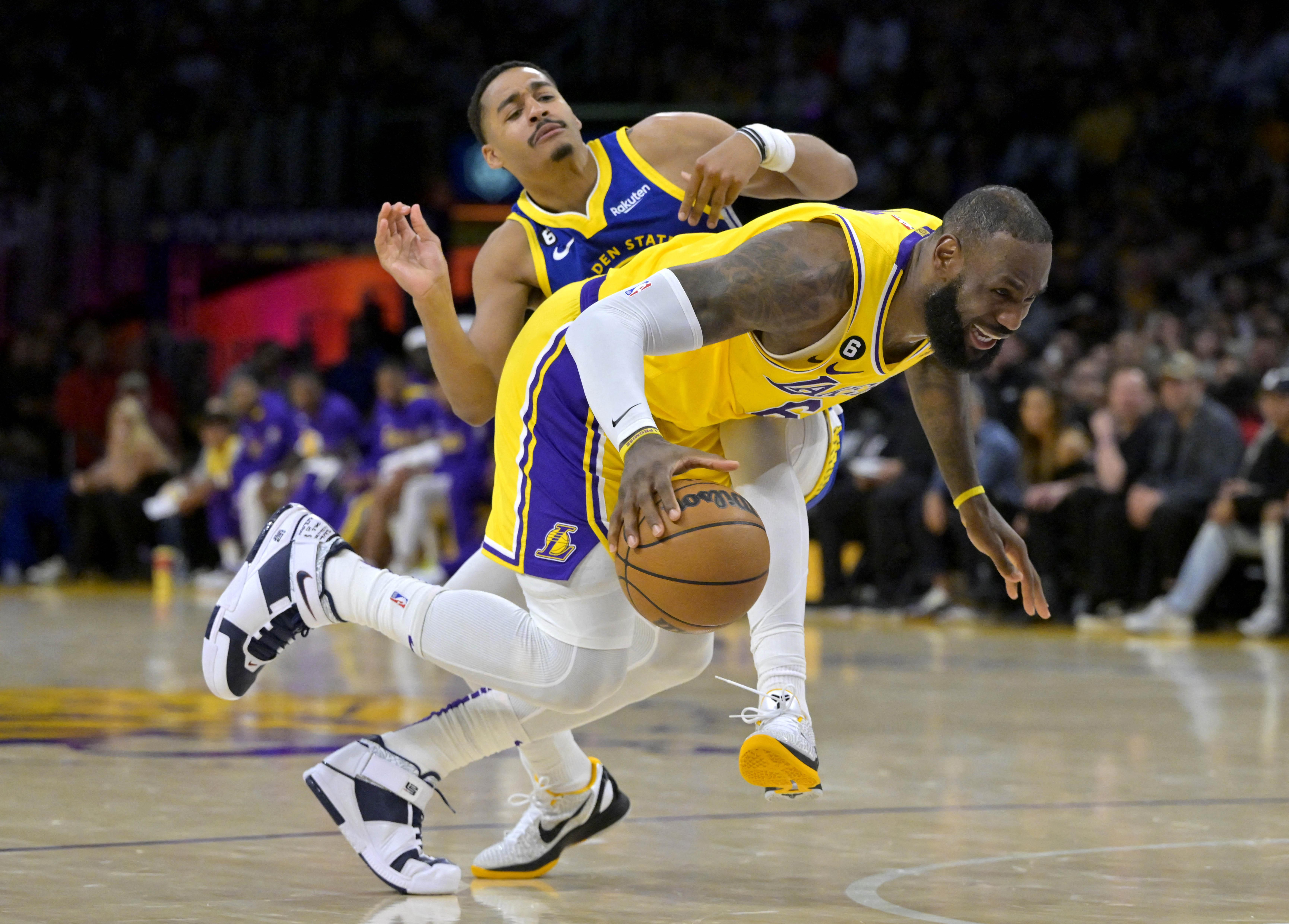 Golden State Warriors' Stephen Curry (30) reacts after getting his shot  blocked by Los Angeles Lakers' Austin Reaves (15) during the second half of  an NBA basketball game Sunday, March 5, 2023